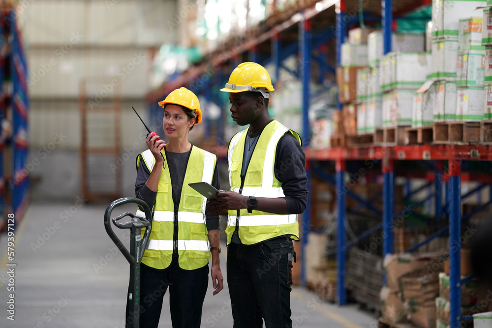 Worker Doing Inventory in Warehouse. Dispatcher in uniform making inventory in storehouse. supply chain concept Worker Doing Inventory in Warehouse. Dispatcher in uniform making inventory in storehouse. supply chain concept