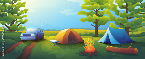 Outdoor camping in the forest. Two tents stand near the fire.