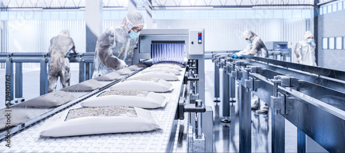 Production line - packing cricket larvae into paper packages