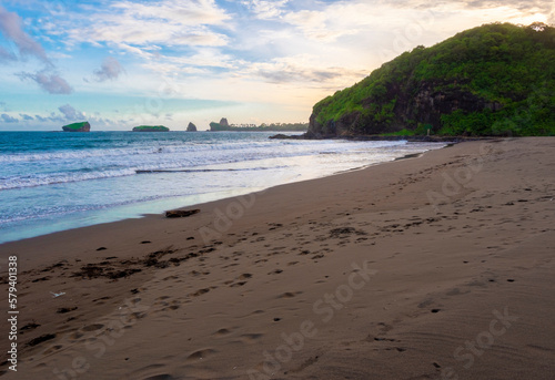 watu ulo jember beach coast, small reef island, and hill at beach