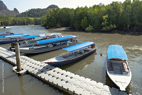 Boats on the water in Kilim Geoforest Park Malaysia photo