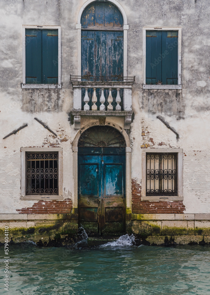 Beautiful charming facade of an old building in Venice, Italy