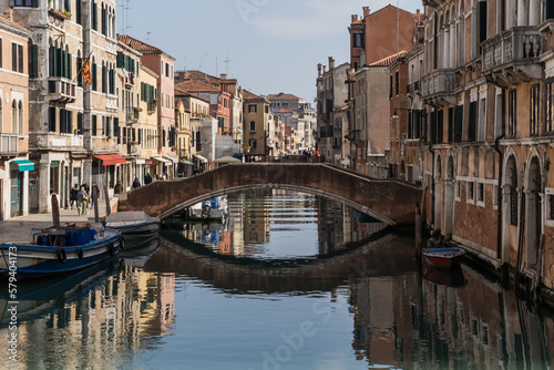 A beautiful and charming view of a canal in Venice, Italy, during early spring showing its typical architecture  © gammaphotostudio