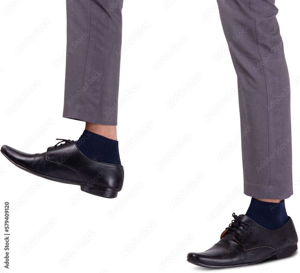 Foot of businessman walking for achievement, leg of leadership moving progress, metaphor and conceptual, copy space, cut out, man standing, business concept.