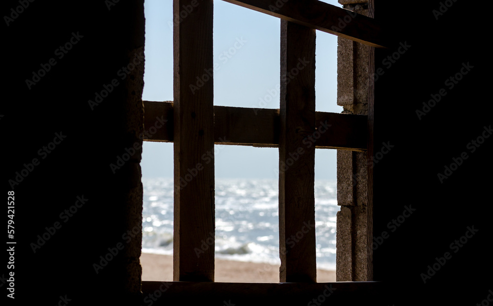 sea view from old wooden window