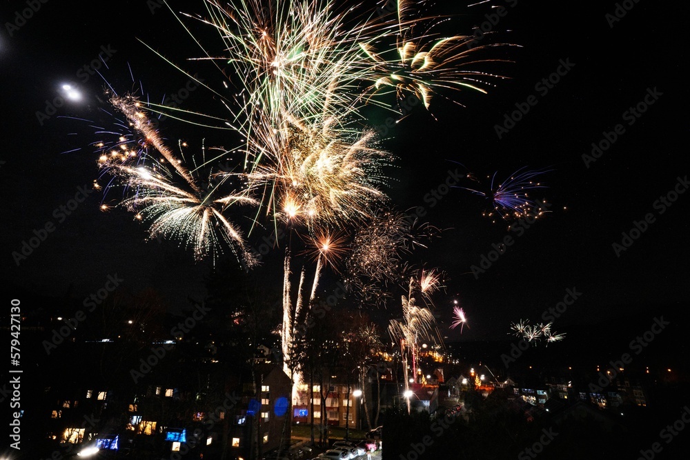 Beautiful shot of exploding fireworks in a dark night sky Beautiful shot of exploding fireworks in a dark night sky