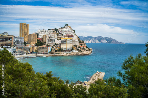 Benidorm tourist town. apartment buildings, hotels on La Cala de Finestrat. Panorama of the densely built-up city with mountains in the background