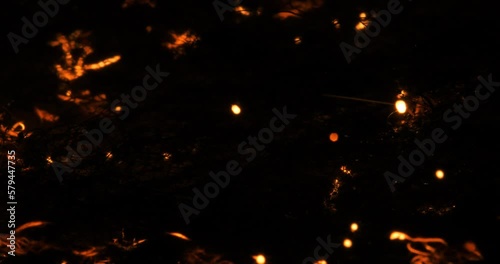 Glowing flashes, explosions passing through thin threads on a black background. Pulse flashes. Neural networks. Gorenje wire fiber. Looped. Brightly glowing multiple fiery explosions. real photo