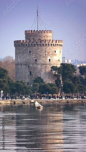 Vertical shot of the White Tower of Thessaloniki at the river