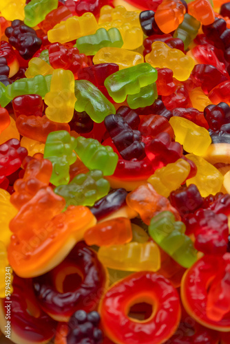 Assorted colorful gummy candies. Top view. Jelly donuts. Jelly bears. Isolated on a white background.
