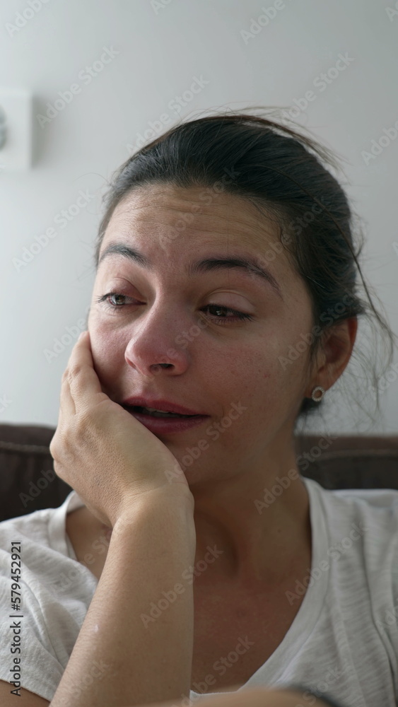One tearful woman wiping tears. Crying female person going through hard times. Depressed emotion suffering from mental distress in Vertical Video One tearful woman wiping tears. Crying female person going through hard times. Depressed emotion suffering from mental distress in Vertical Video