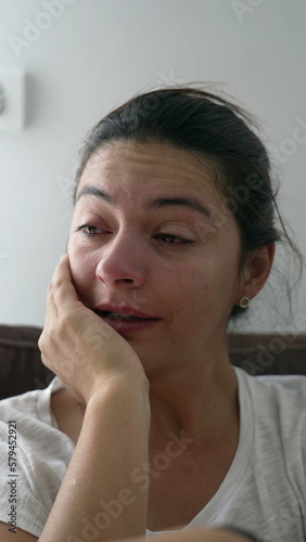 One tearful woman wiping tears. Crying female person going through hard times. Depressed emotion suffering from mental distress in Vertical Video