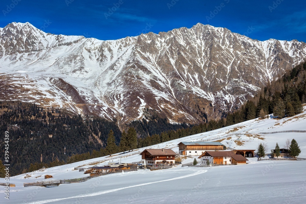 Aerial view of snow covered mountain landscape with trees Aerial view of snow covered mountain landscape with trees