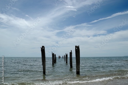Wooden piles of a disused Wharf in the sea in Golden Bay near Takaka, New Zealand