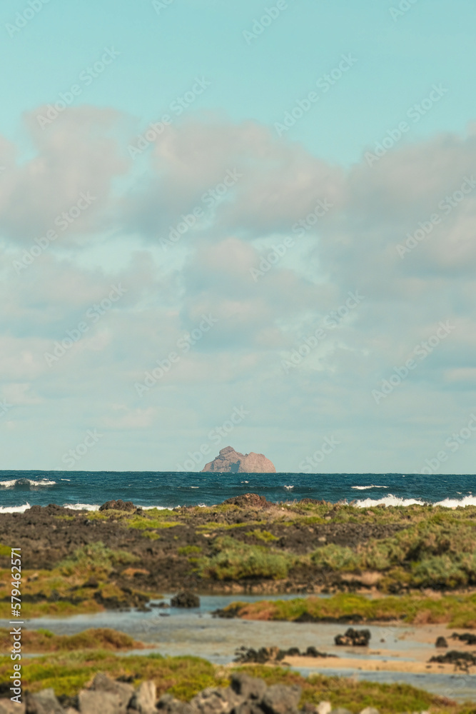 Far East Rock (Roque del Este) over the sea at the north of Lanzarote. Shot from Caletón Blanco, Canary Islands, Spain