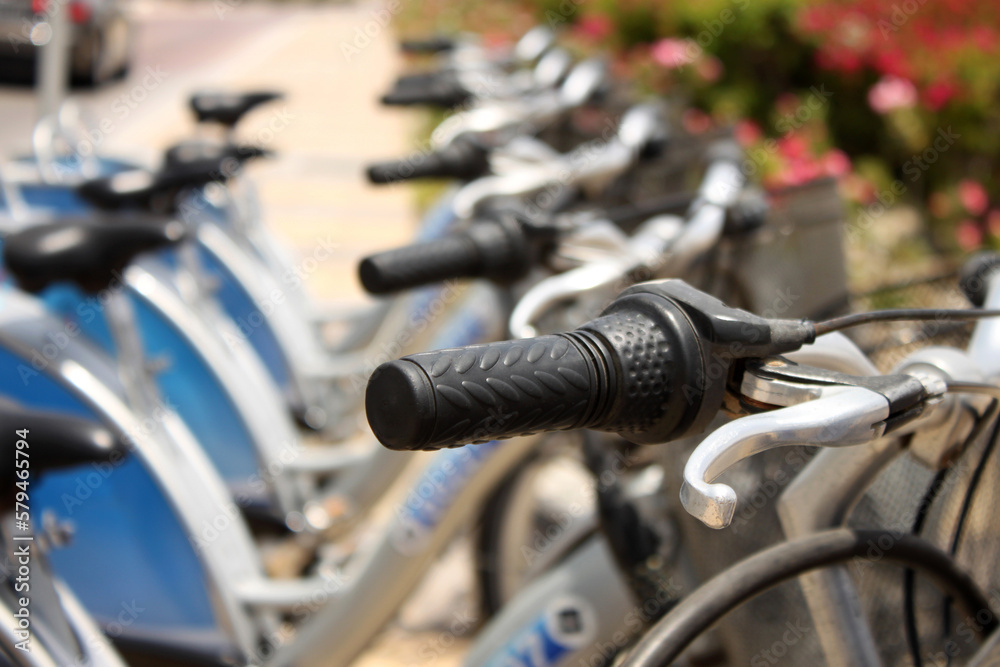 Row of rental city bikes at docking station in Dubai Row of rental city bikes at docking station in Dubai