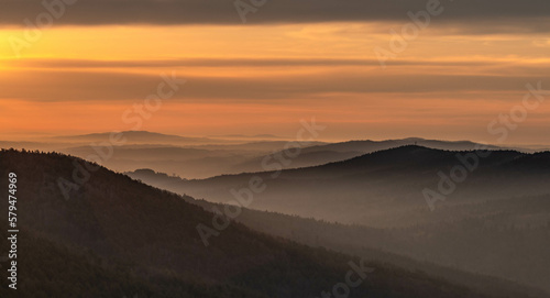 The view of a beautiful landscape at sunrise with amazing light and a mysterious atmosphere.