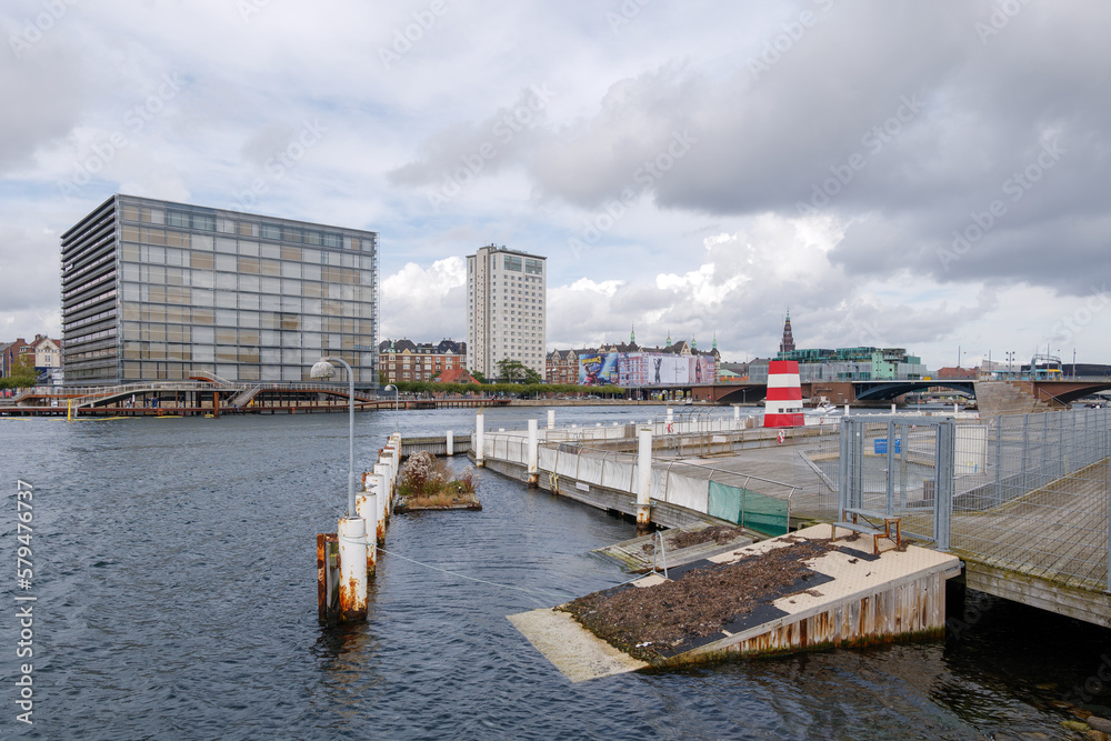 Outdoor scenery of floating bird nest beside Havnebadet Islands Brygge and background of waterfront of Marriott hotel in Copenhagen, Denmark. 