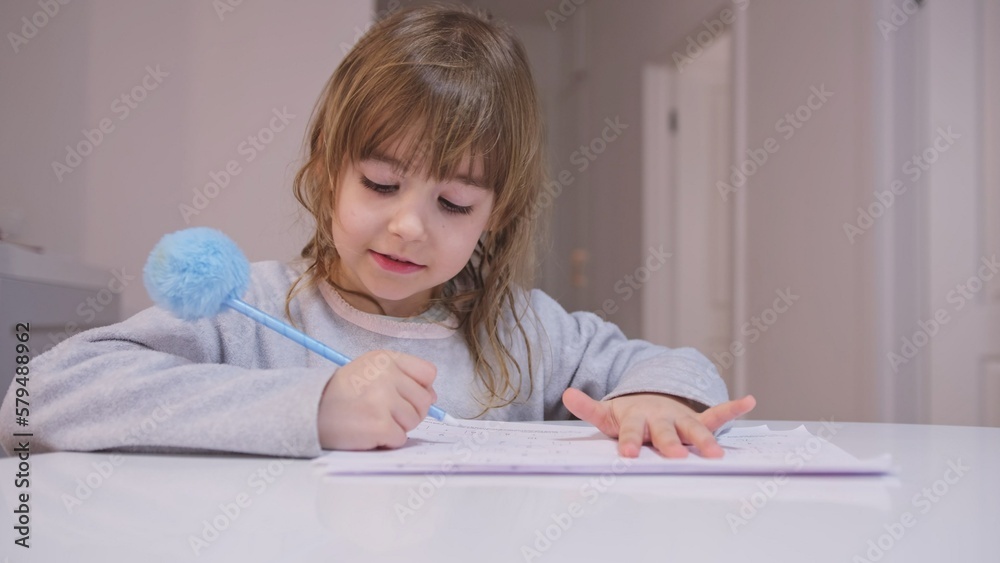 Smart Young Caucasian Girl Preshooler Doing Math Homework Counting Numbers with Her Fingers Smart Young Caucasian Girl Preshooler Doing Math Homework Counting Numbers with Her Fingers
