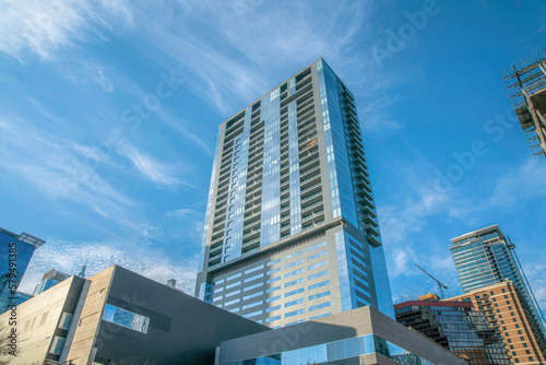 Fotografie, Tablou Modern high-rise condominium with balconies in a low angle view at Austin, Texas
