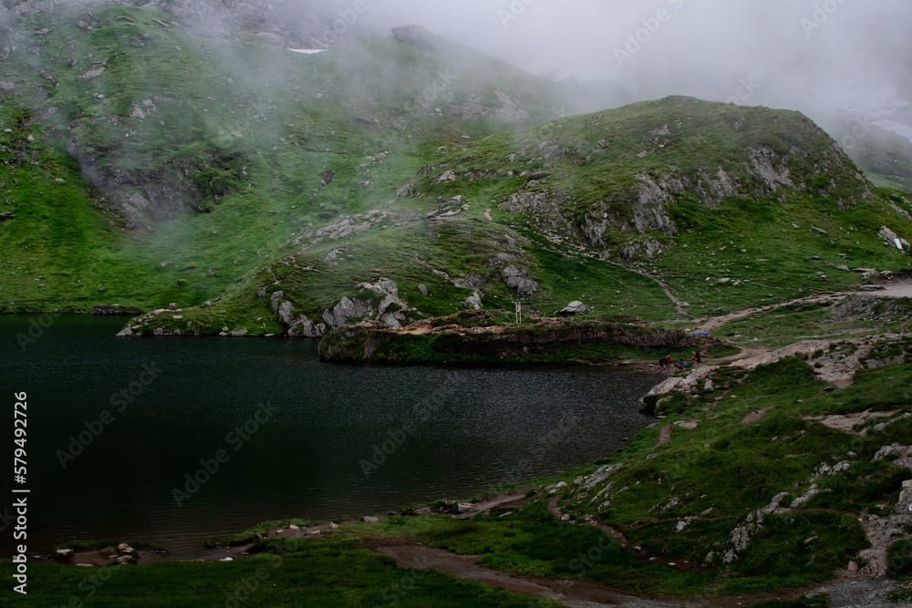 Fototapeta premium Balea Lac, Transfagarasan Romania fog covered lake during green summer