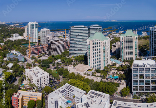 Aerial view of modern buildings and blue ocean in scenic Miami Florida. Residential and commercial properties with beautiful architecture and wonderful sea view.