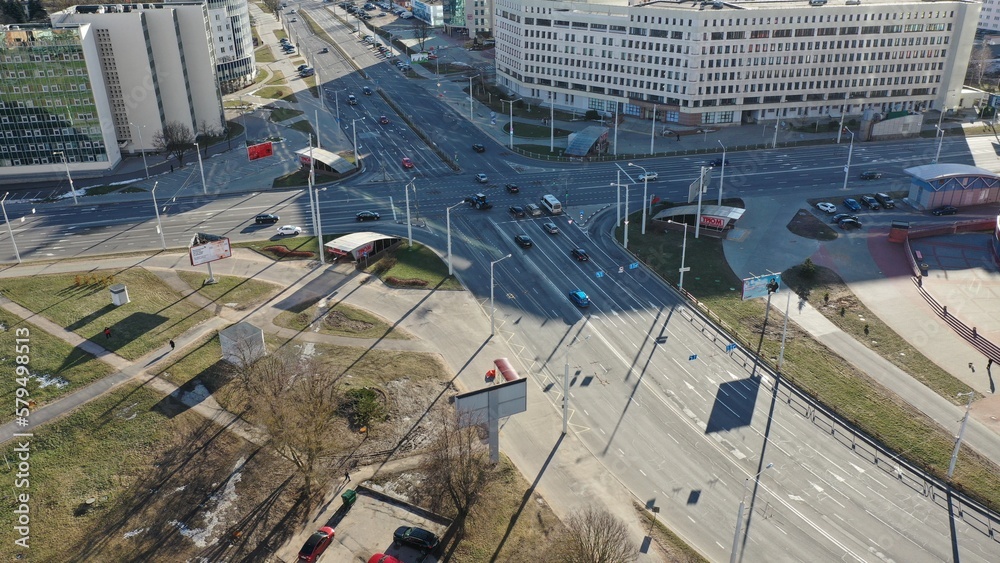 Traffic of people and vehicles (cars) at the crossroads in Minsk, the capital of Belarus. Public traffic in Minsk, Europe. The quality of the road network in Belarus