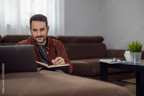 Man using laptop, writing email,online meeting or payment online