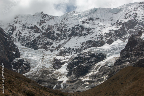 View of the mountain and the glacier Salcantay, with incredible clouds, from the city of Soray, in Peru.  photo