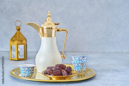 Traditional arabic coffee with dates . Ramadan decor with Arabian coffee set photo