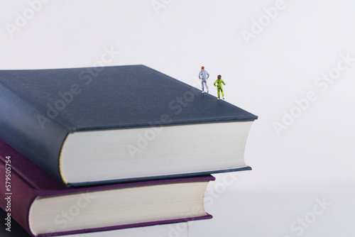 joggers, runners train on a stack of books