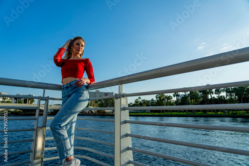 A Lovely Blonde Model Enjoys The Summer Weather In An Urban Environment © Grindstone Media Grp