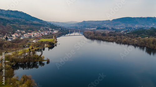 Aerial drone photography over the Mino river in the town of Barbantes in the province of Orense, in Galicia, Spain.