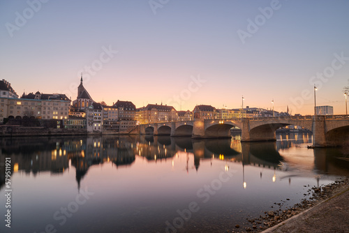 Beautiful sunset on the banks of the Rhine River, in the city of Basel, Switzerland. © MiguelAngel