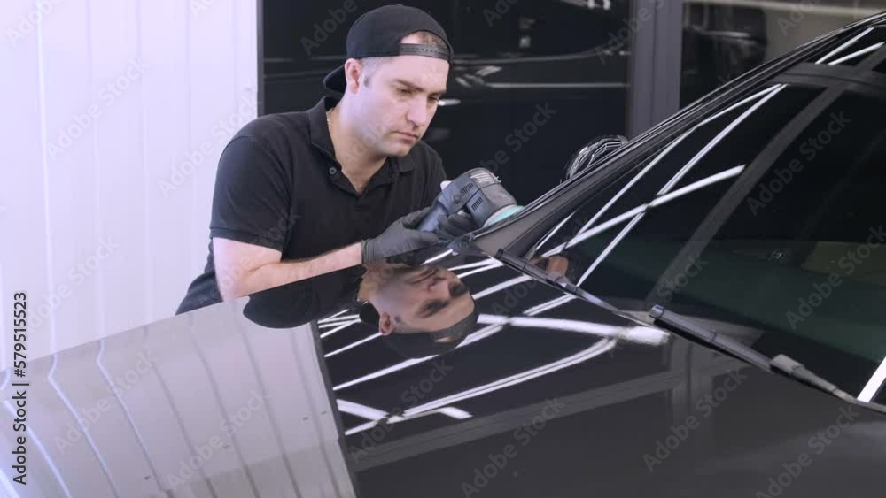 Professional car detailing using machinery and polishers for paint restoration. Professional car detailing using machinery and polishers for paint restoration.