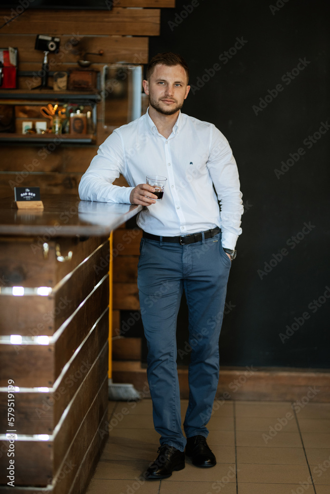 portrait of a young guy groom at the training camp in the barbershop