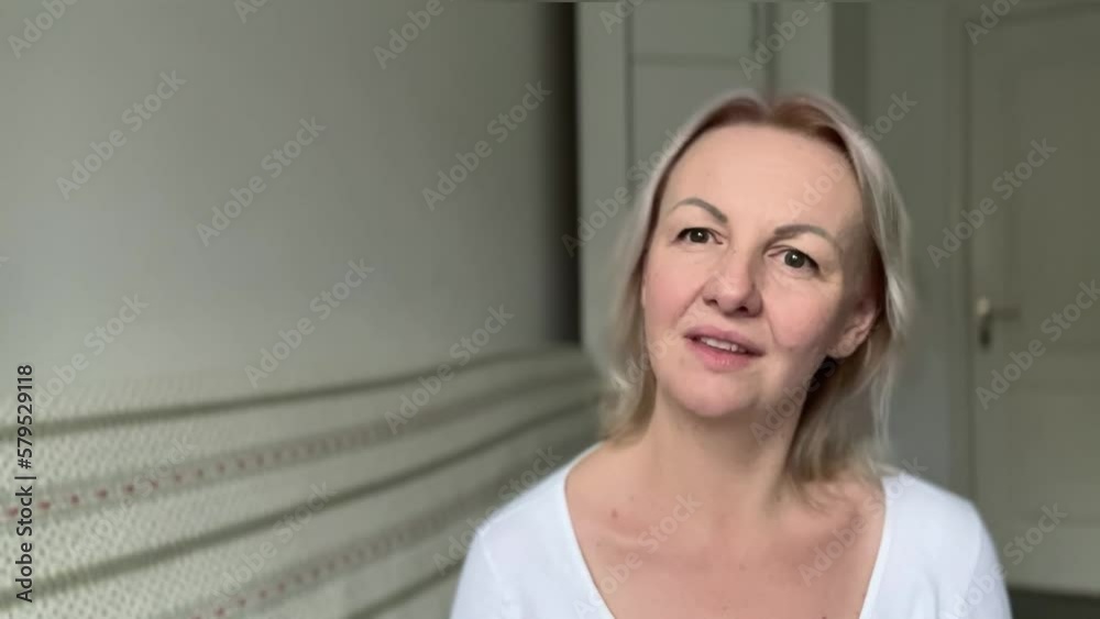 Thoughtful woman looks pensively above dressed in casual white jumper poses against blank copy space for your advertising content thinks about future adult blonde Thoughtful woman looks pensively above dressed in casual white jumper poses against blank copy space for your advertising content thinks about future adult blonde
