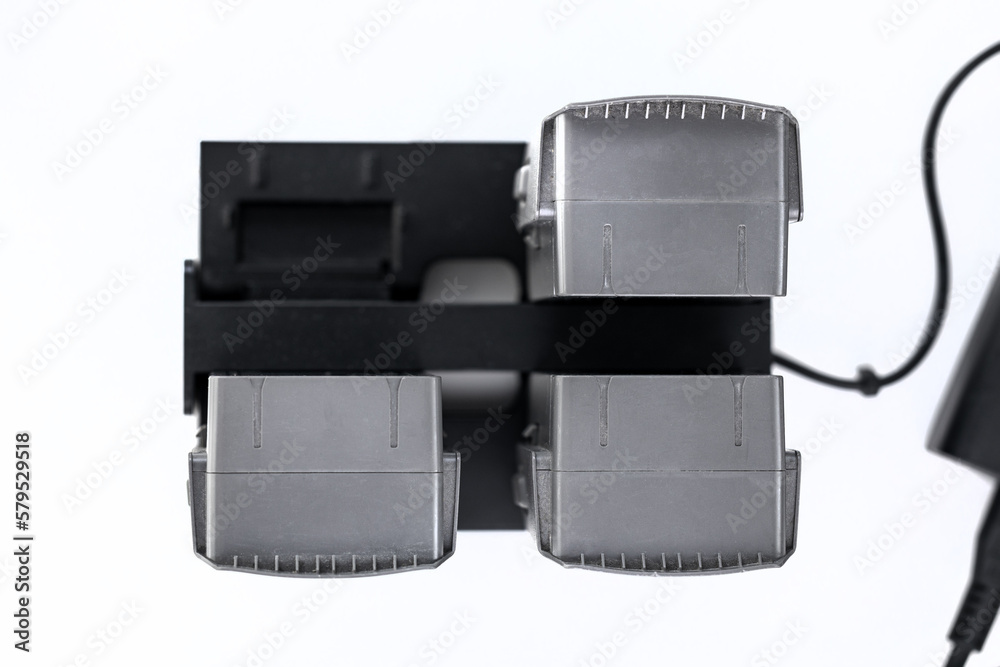 Batteries from the quadcopter are charging, lithium-ion high-current batteries are charging Batteries from the quadcopter are charging, lithium-ion high-current batteries are charging