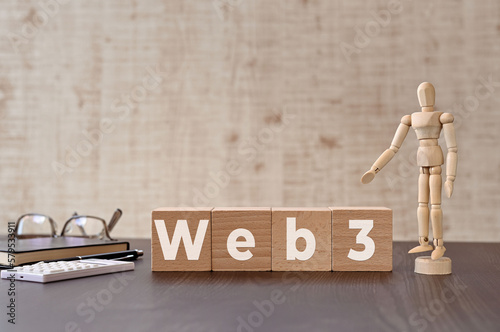 There is wood cube with the word Web3. It is eye-catching image.