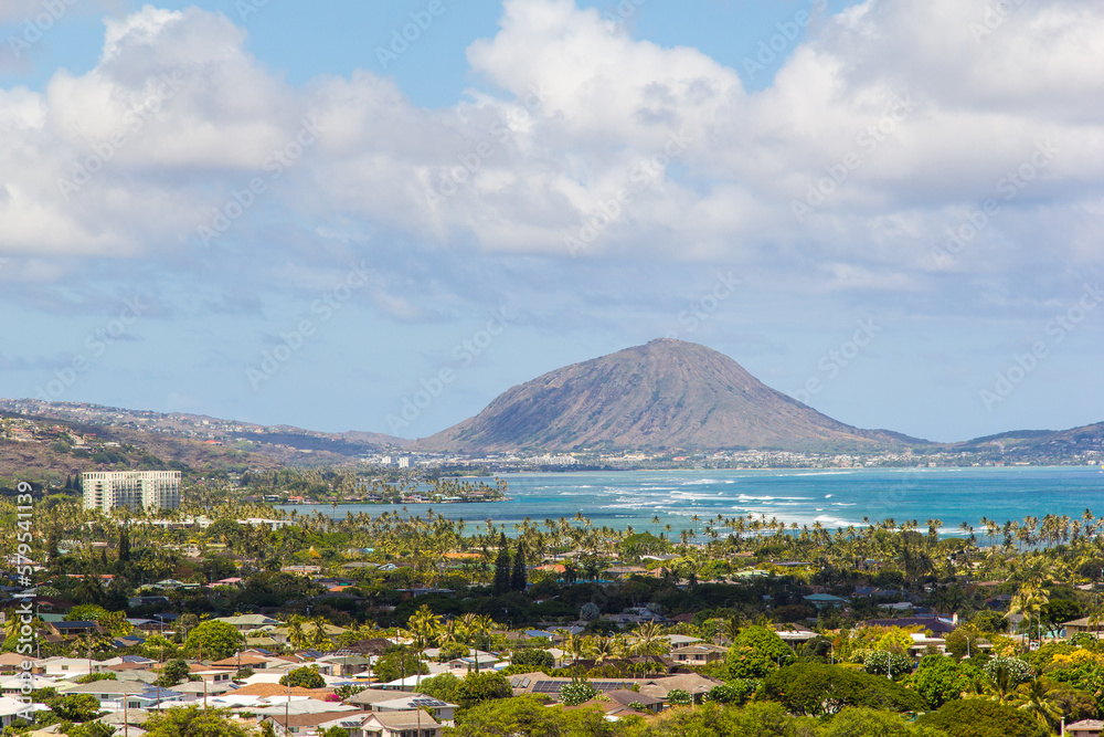 View of the city of Honolulu from above at the top of Diamond Head Crater, in Oahu, Hawaii. Sail boats and buildings.