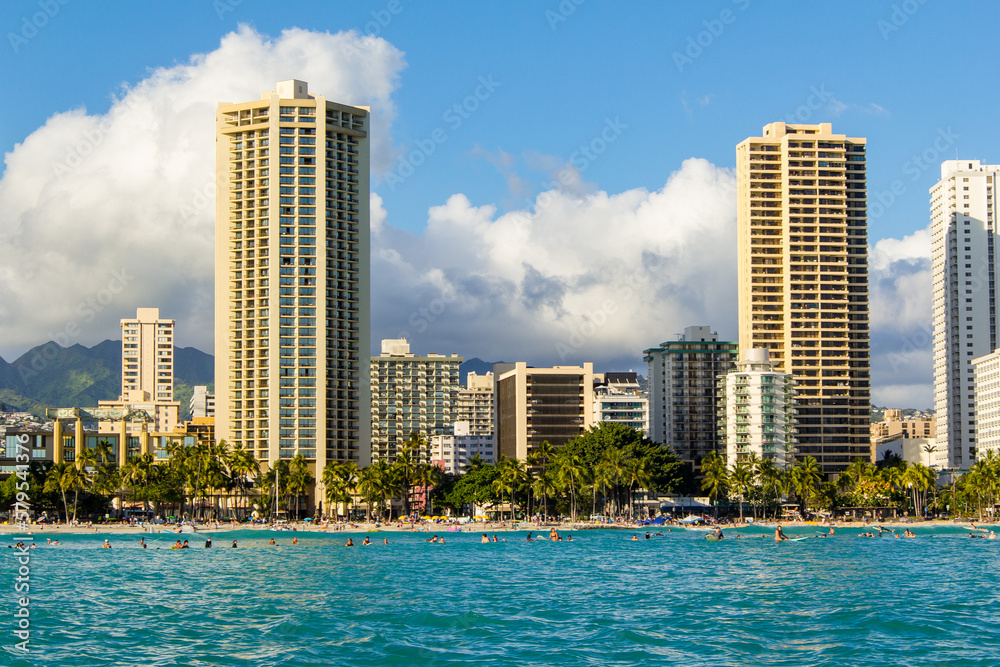 Views of Honolulu from the water off the coast.