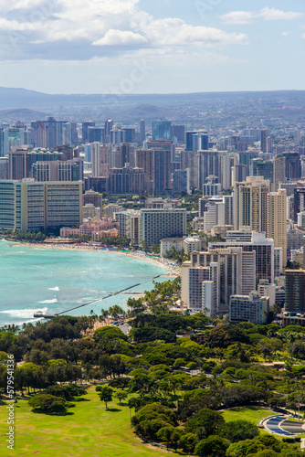View of the city of Honolulu from above at the top of Diamond Head Crater, in Oahu, Hawaii. Sail boats and buildings. © Adam