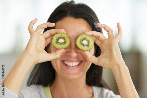 cheerful woman with  and kiwi eyes
