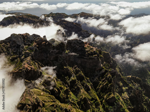 Drone view of Madeira Mountains Pico do Arieiro, Portugal. Rocky peaks over the clouds.