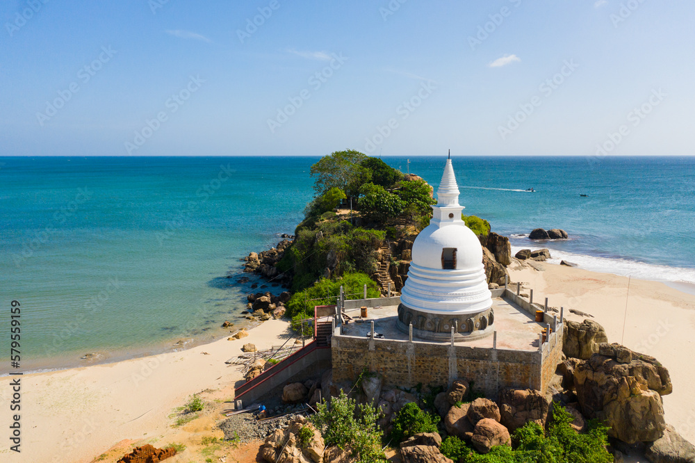 Fototapeta premium Buddhist monastery, stupa on the beach near the ocean. Sri Lanka.