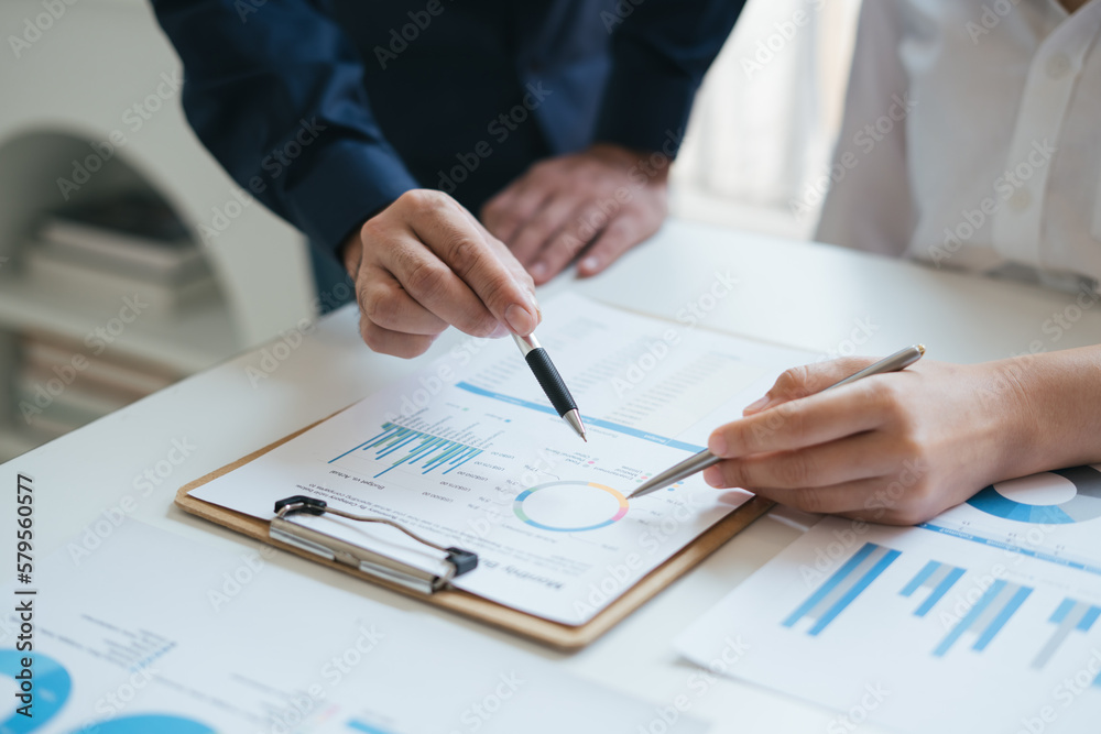 Business sales consultant discussing in data documents at modern office. Business sales consultant discussing in data documents at modern office.