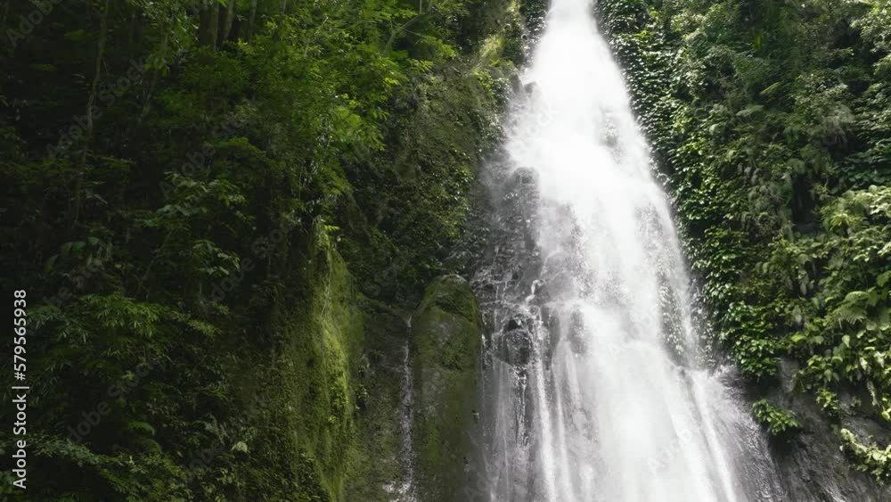 Top view of Jungle Waterfall in slow motion. Pulang-Tubig Falls. Negros, Philippines. Top view of Jungle Waterfall in slow motion. Pulang-Tubig Falls. Negros, Philippines.