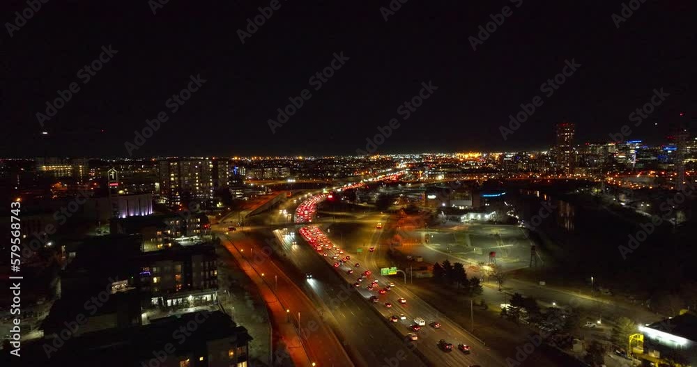 Aerial view of Cars Driving Down the Interstate at Night in Denver, Colorado Aerial view of Cars Driving Down the Interstate at Night in Denver, Colorado