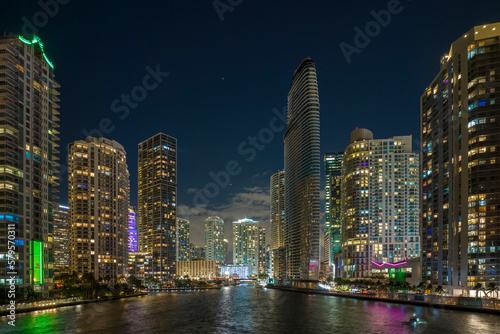 Aerial view of downtown district of of Miami Brickell in Florida, USA. Brightly illuminated high skyscraper buildings in modern american midtown