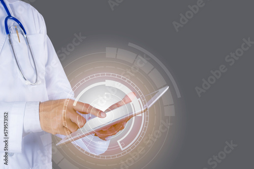Doctor using tablet with internet.